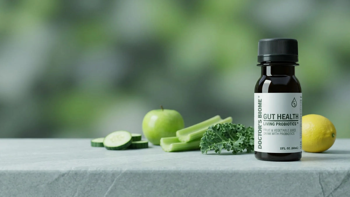 Doctor's Biome living probiotic shots beside the fresh fruit and vegetables their juice base is pressed from
