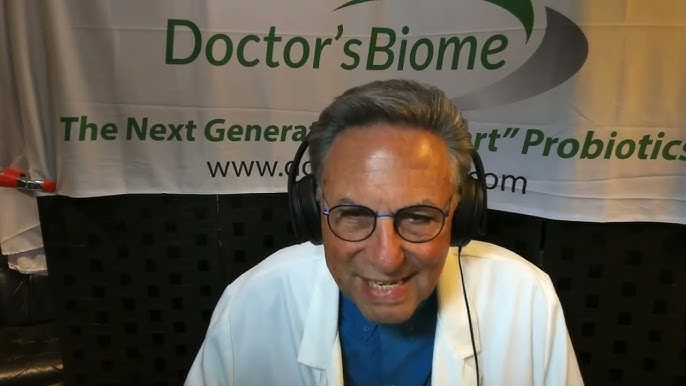 Dr. Howard Robins in headphones at a microphone, recording a podcast in front of a Doctor's Biome banner.